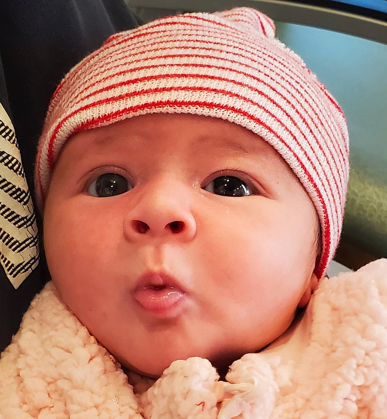 Ayla joined the competition — help win amazing prizes! baby, baby_toddler_clothing, cap, cheek, child, chin, close_up, eyelash, facial_expression, happy, headgear, headwear, knit_cap, lip, mouth, nose, organ, person, photograph, pink