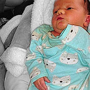 Wyatt joined the competition — help win amazing prizes! animal_print, baby, blanket, child, comfort, cozy, cute, expression, fabric, face, hand, indoors, infant, newborn, onesie, portrait, relaxation, resting, sleepwear, soft_texture