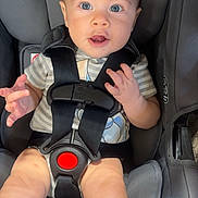 Eli joined the competition — help win amazing prizes! baby, car_seat, graco, child, infant, seatbelt, harness, clothing, socks, person, sitting, cute, expression, indoor, safety, seat, headrest, babywearing, hands, legs