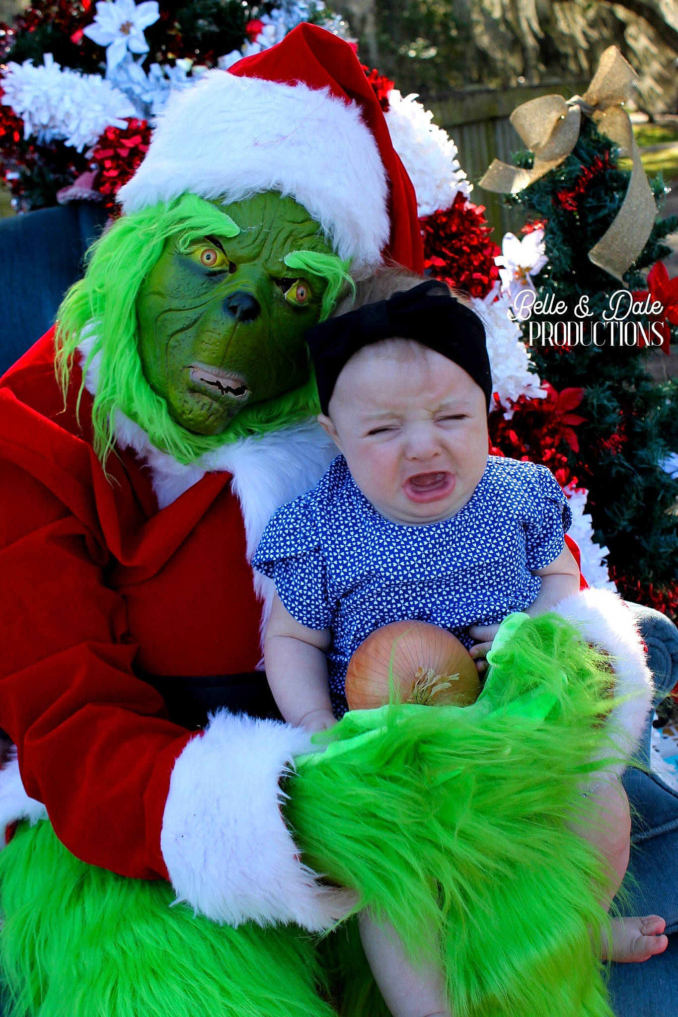 Christine is registered to the contest to win money with this photo: costume, costume_hat, event, facial_expression, fictional_character, fun, fur, glove, grass, green, happy, hat, headgear, headwear, holiday, person, plant, public_event, santa_claus, smile