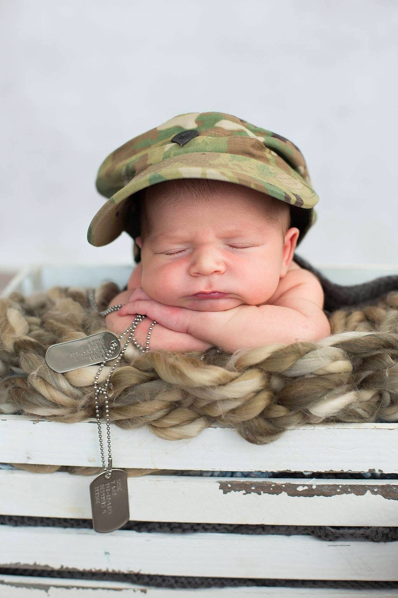 Caden is registered to the contest to win money with this photo: baby, camouflage, cheek, child, headgear, military, military_camouflage, military_uniform, person, smile, soldier, toddler, uniform