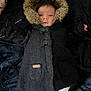 baby, infant, coat, hood, fur, black_coat, blanket, white_pants, lying_down, indoor, face, person, cute, warm_clothing, child, newborn, sleepwear, portrait, baby_clothes, soft