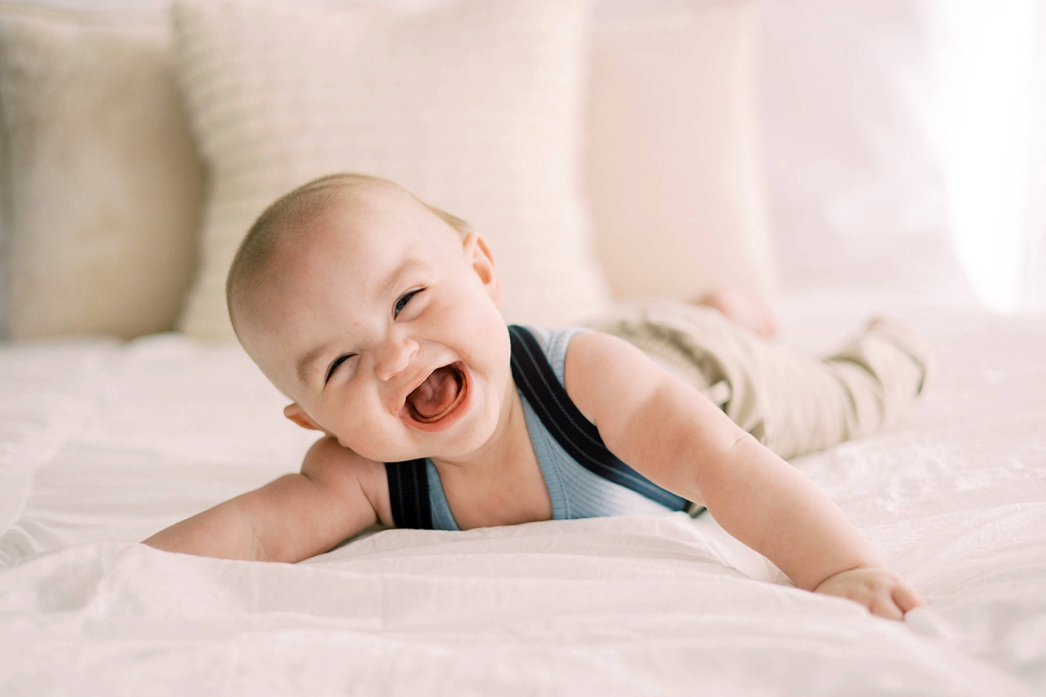 Reece is registered to the contest to win money with this photo: baby, baby_sleeping, baby_toddler_clothing, bed, bedding, child, comfort, flash_photography, flooring, happy, human_body, knee, linens, person, portrait_photography, room, sitting, skin, sleeve, smile