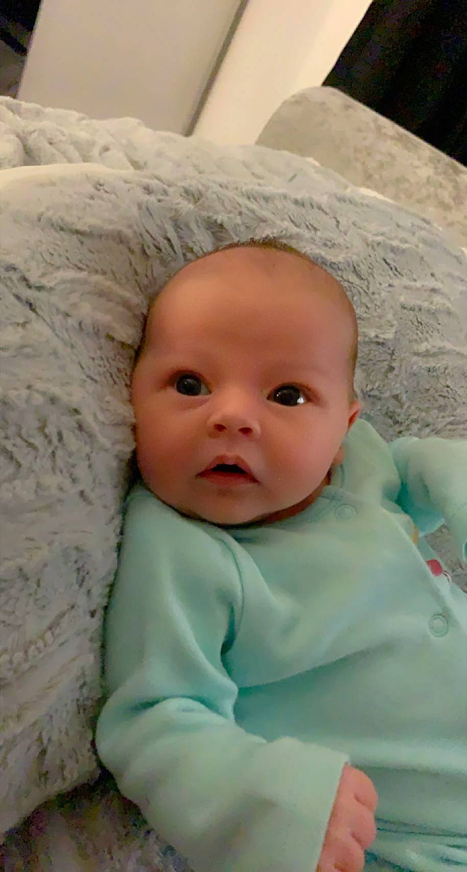 Alishyia is registered to the contest to win money with this photo: baby, baby_toddler_clothing, bedding, cheek, child, chin, comfort, eye, eyebrow, face, fur, happy, head, iris, linens, nose, person, portrait_photography, sleeve, smile