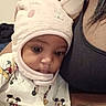 Ma'Laysia is registered to the contest to win money with this photo: adult, baby, bunny_hat, child, closeup, clothing, cute, face, hat, headwear, indoor, infant, mickey_mouse, pajamas, person, portrait, skin, sleepwear, snuggling, warm