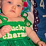 Kiana is registered to the contest to win money with this photo: baby, blue_eyes, bow, child, chubby_cheeks, closeup, fabric, green_dress, hand, headband, infant, lucky_charm_text, lying_down, numbers, pattern, playmat, portrait, sequin, st_patricks, tutu