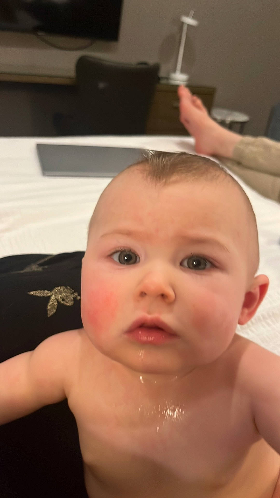 Lilly is registered to the contest to win money with this photo: baby, bathing, cheek, chest, ear, eyebrow, eyelash, finger, forehead, gesture, hand, iris, joint, lip, mouth, neck, nose, person, skin, surprise