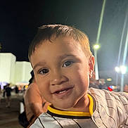 Zebediah is registered to the contest to win money with this photo: background, casual, child, closeup, clothing, crowd, cute, event, face, fun, happy, lights, night, outdoor, people, person, portrait, smiling, striped_shirt, young_child