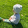 Arian joined the competition — help win amazing prizes! toddler, child, grass, outdoor, sunlight, hat, socks, sitting, nature, greenery, casual_clothing, peaceful, daylight, young_child, baby, grass_field, portrait, side_view, relaxing, cute