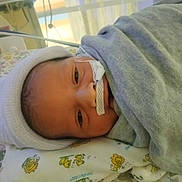 Ellabeth joined the competition — help win amazing prizes! newborn, baby, infant, hospital, blanket, hat, face, nasal_tube, lying_down, medical_equipment, cute, swaddled, bed, child, healthcare, portrait, soft_lighting, closeup, patient, wrapped