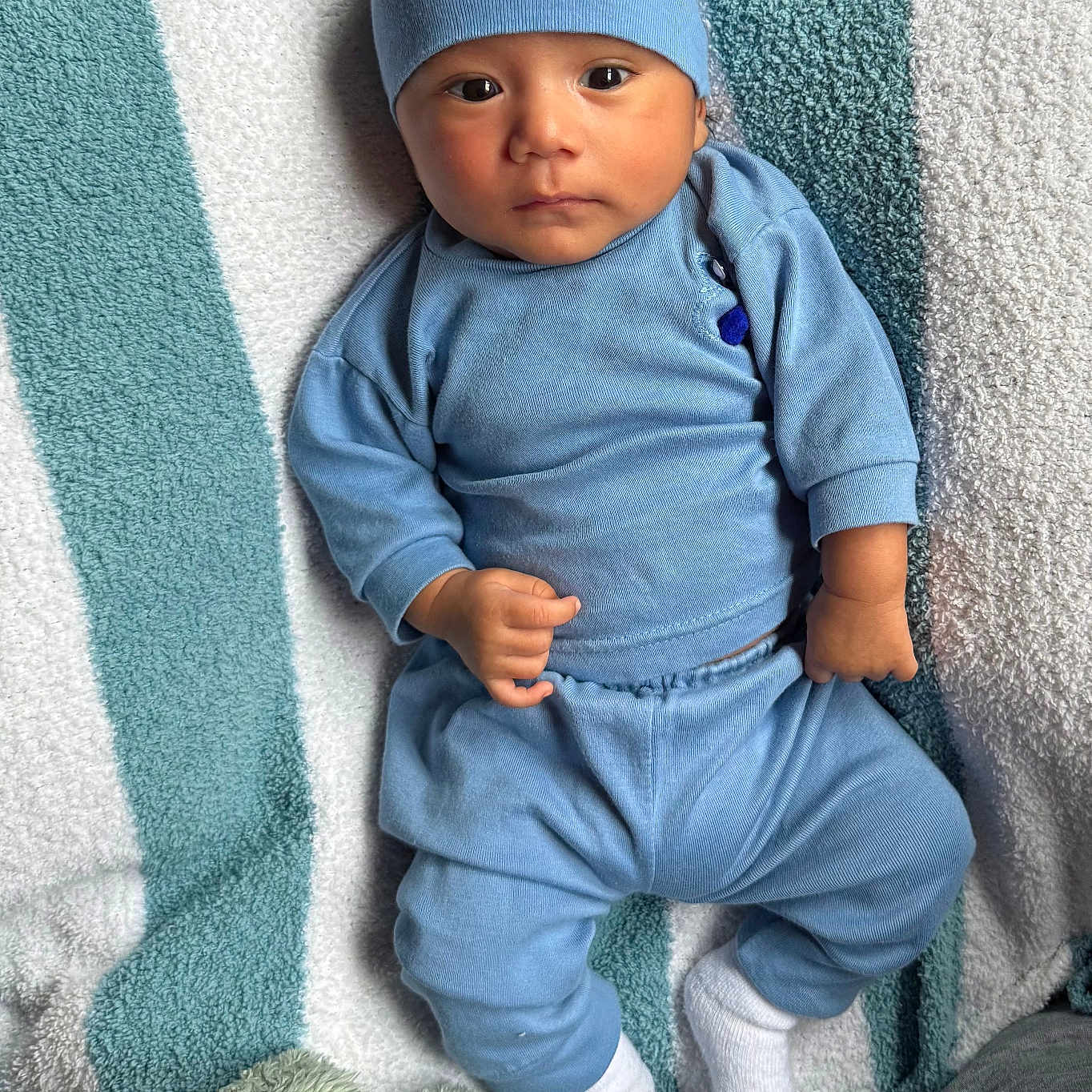 Alex joined the competition — help win amazing prizes! baby, baseballcap, beanie, blanket, bonnet, cap, clothing, face, fleece, furniture, hat, head, hosiery, jeans, newborn, pants, person, photography, portrait, sock