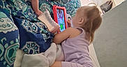 Emerald joined the competition — help win amazing prizes! baby, toddler, bed, blanket, pillow, tablet, bottle, child, indoor, playing, purple, clothing, footwear, carpet, technology, toy, furniture, person, sleepwear, room