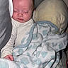 Bentley is registered to the contest to win money with this photo: baby, sleeping, blanket, plush_toy, cozy, infant, bedtime, soft, comfort, child, pajamas, face, head, indoor, rest, peaceful, cute, person, cuddly, nap