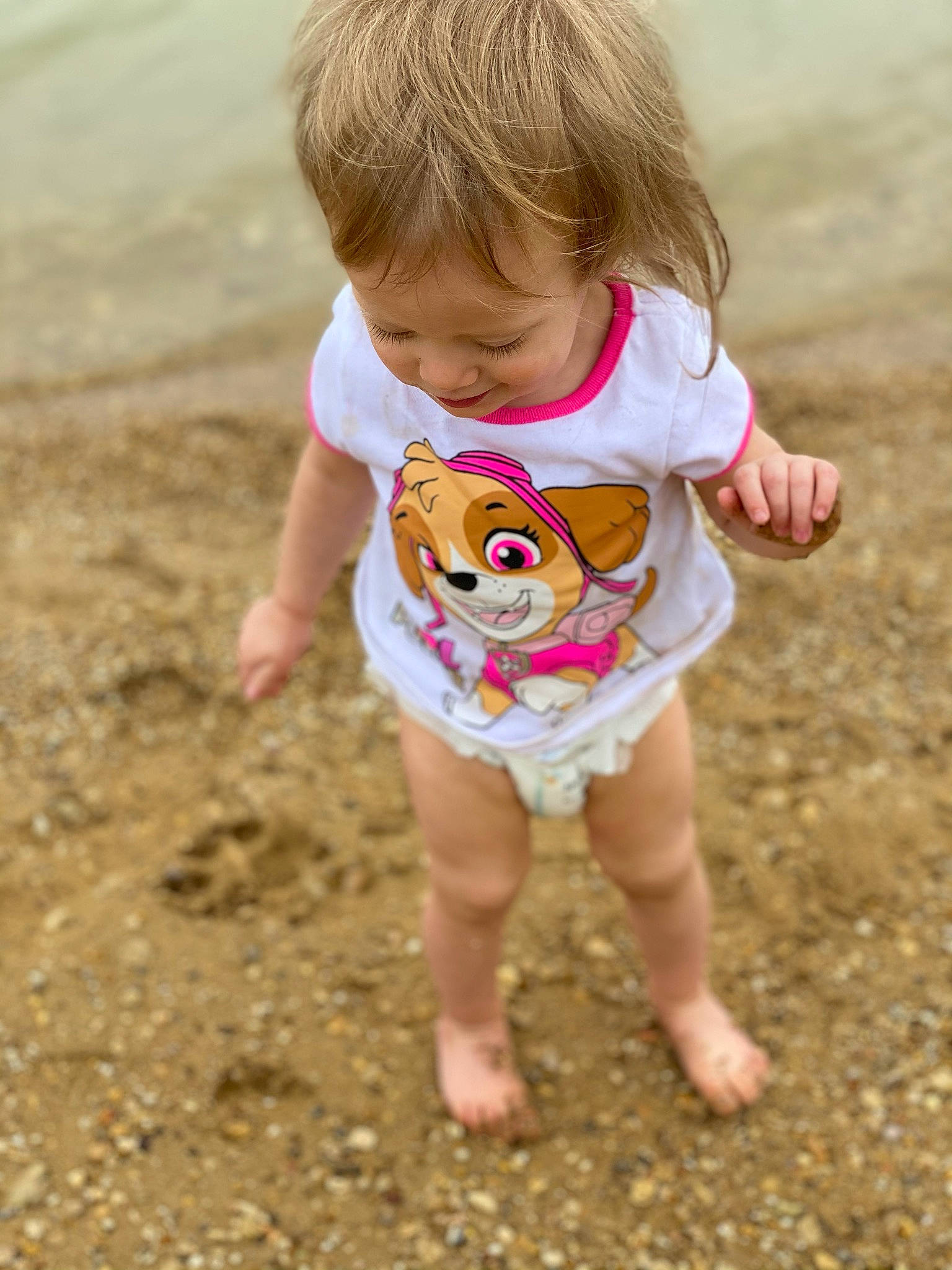 Skye joined the competition — help win amazing prizes! baby_toddler_clothing, barefoot, child, fun, grass, hair, hairstyle, hand, happy, head, leisure, people_in_nature, person, sand, shorts, sleeve, smile, summer, t_shirt, toddler