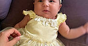 Miracle joined the competition — help win amazing prizes! baby, child, infant, dress, yellow, headband, bow, couch, purple, hand, smile, cute, indoors, person, fashion, tulle, lace, portrait, happy, young