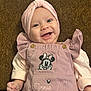 baby, smiling, pink_headband, minnie_mouse, overalls, infant, happy, cute, child, portrait, clothing, baby_girl, hand, background, indoor, headwear, person, closeup, joy, fashion
