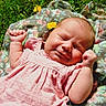 baby, infant, pink_dress, flower, yellow_flower, blanket, floral_pattern, grass, sunlight, outdoor, cute, sleeping, peaceful, skin, hand, portrait, child, nature, relaxation, summer