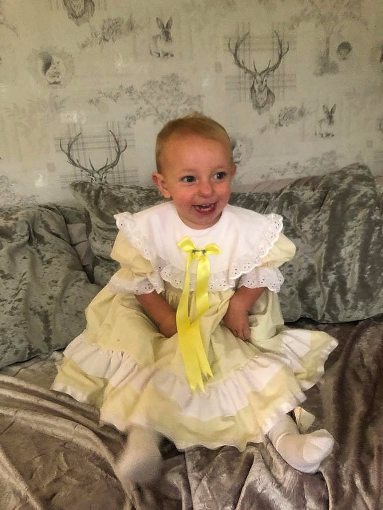 Darcy is registered to the contest to win money with this photo: baby, child, costume, joy, person, photograph, portrait, sitting, smile, toddler