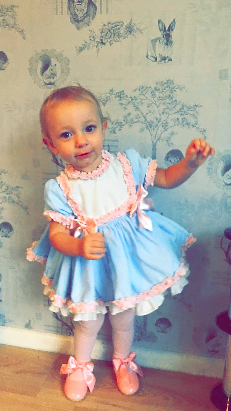 Darcy joined the competition — help win amazing prizes! baby, baby_toddler_clothing, child, clothing, dress, pattern, person, product, toddler