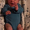 Holden is registered to the contest to win money with this photo: baby, infant, blue_onesie, blanket, sheep_pattern, cute, newborn, person, skin, legs, arms, face, expression, lying_down, indoors, soft_texture, small_hands, small_feet, cozy, child