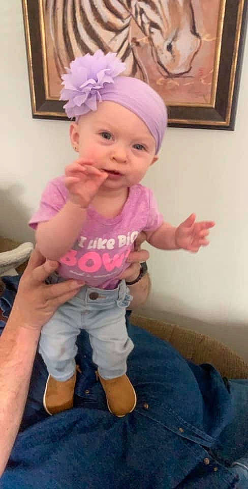 Aleigha is registered to the contest to win money with this photo: arm, baby, baby_products, baby_toddler_clothing, child, hair_accessory, headband, headgear, headwear, person, pink, toddler