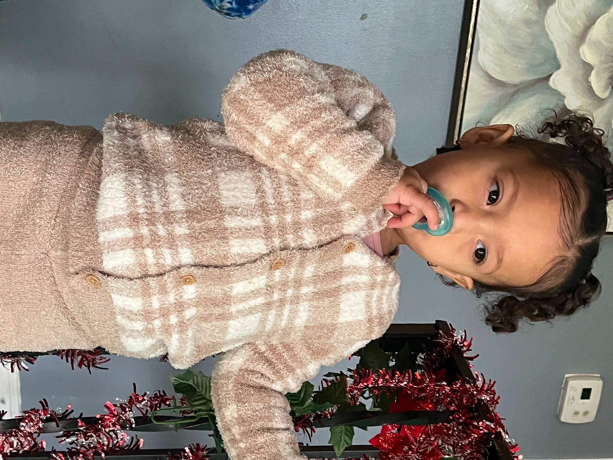 Naomie joined the competition — help win amazing prizes! baby, baby_toddler_clothing, cheek, child, christmas, christmas_tree, event, eye, fun, gesture, happy, head, holiday, lap, pattern, person, plaid, room, sitting, tartan