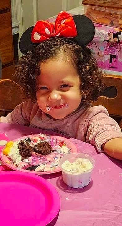 Naomie joined the competition — help win amazing prizes! baking, birthday, chair, child, cuisine, dish, event, food, food_craving, happy, icing, ingredient, joy, person, pink, plate, sharing, smile, sweetness, table