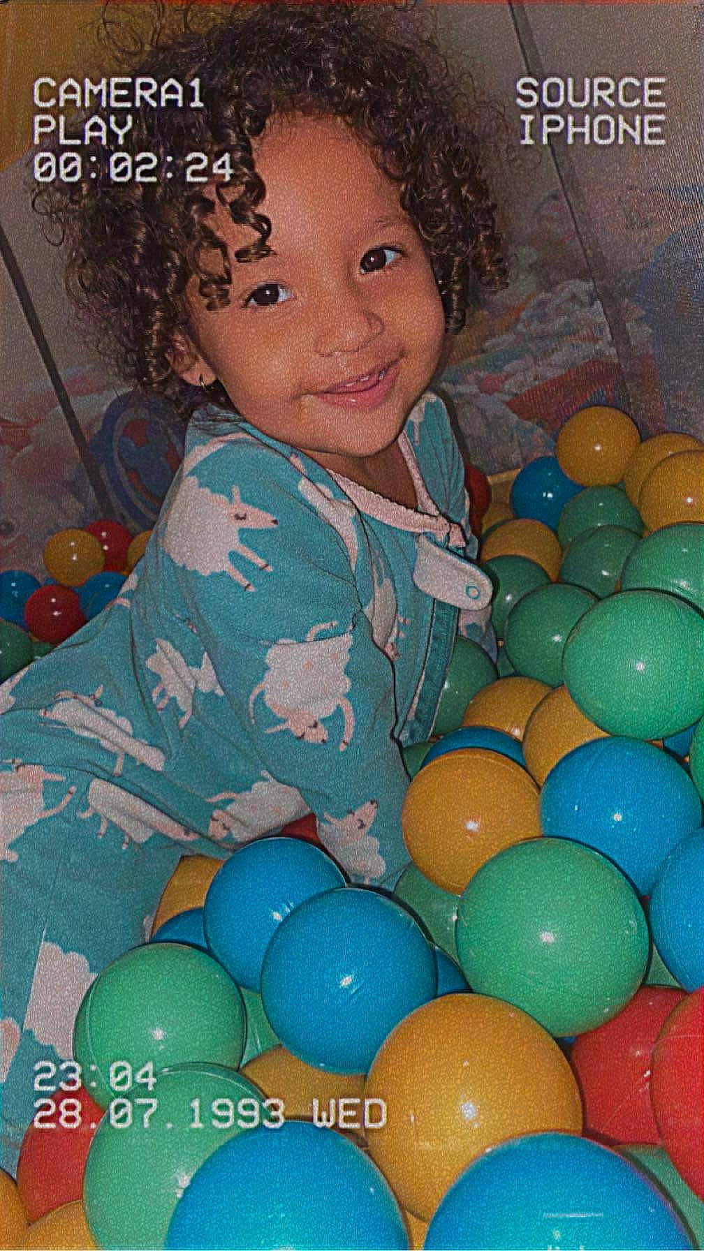 Naomie is registered to the contest to win money with this photo: afro, baby_playing_with_toys, ball, ball_pit, cheek, child, circle, electric_blue, event, fun, green, happy, jheri_curl, joy, party_supply, person, play, ringlet, smile, toddler