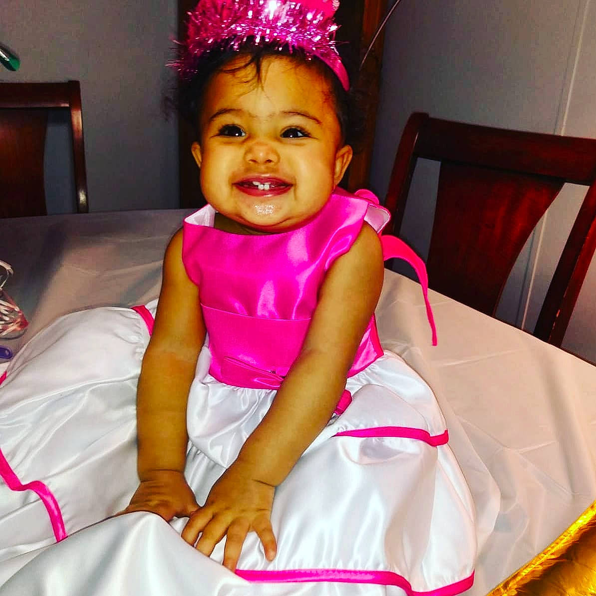 Reign'Amor joined the competition — help win amazing prizes! baby_toddler_clothing, chair, child, costume_hat, day_dress, dress, event, face, fun, hair, happy, head, headband, magenta, person, pink, red, smile, thigh, toddler
