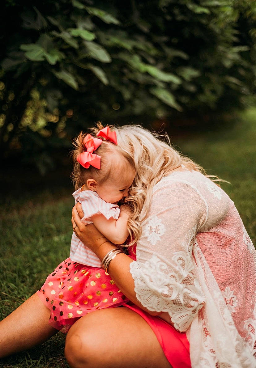 Annalyse is registered to the contest to win money with this photo: blond, brassiere, clothing, dress, fashion, flash_photography, fun, grass, hand, happy, headpiece, human_leg, jewellery, long_hair, magenta, people_in_nature, person, pink, plant, smile