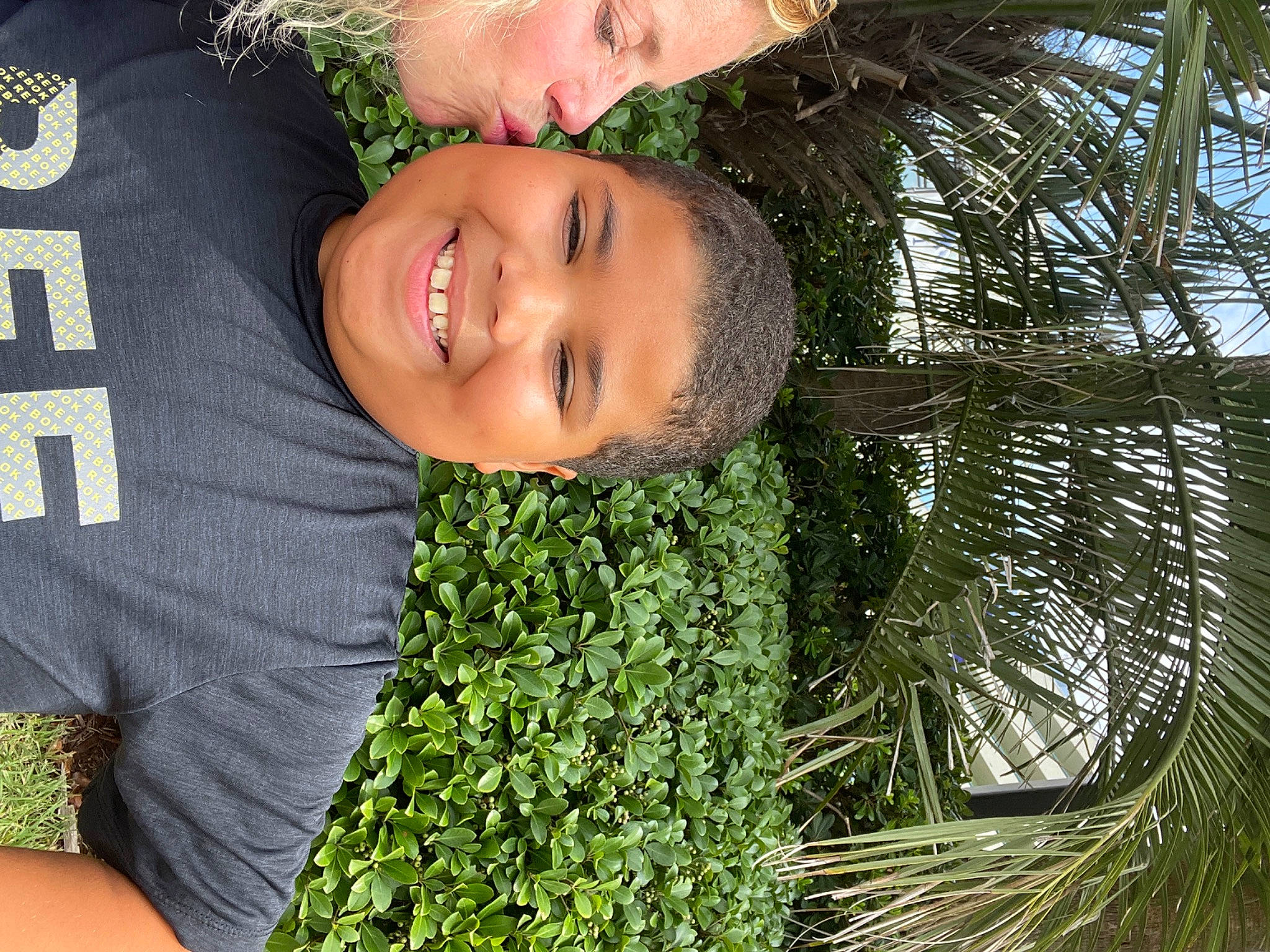 Amari joined the competition — help win amazing prizes! arecales, child, face, flash_photography, fun, garden, grass, green, happy, joy, laugh, leisure, people_in_nature, person, plant, portrait_photography, smile, t_shirt, terrestrial_plant, tree