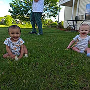 Junior And Jaxton is registered to the contest to win money with this photo: baby, grass, outdoor, smiling, child, house, person, greenery, sunny_day, sitting, happy, footwear, table, window, air_conditioner, clothing, nature, yard, daytime, playful