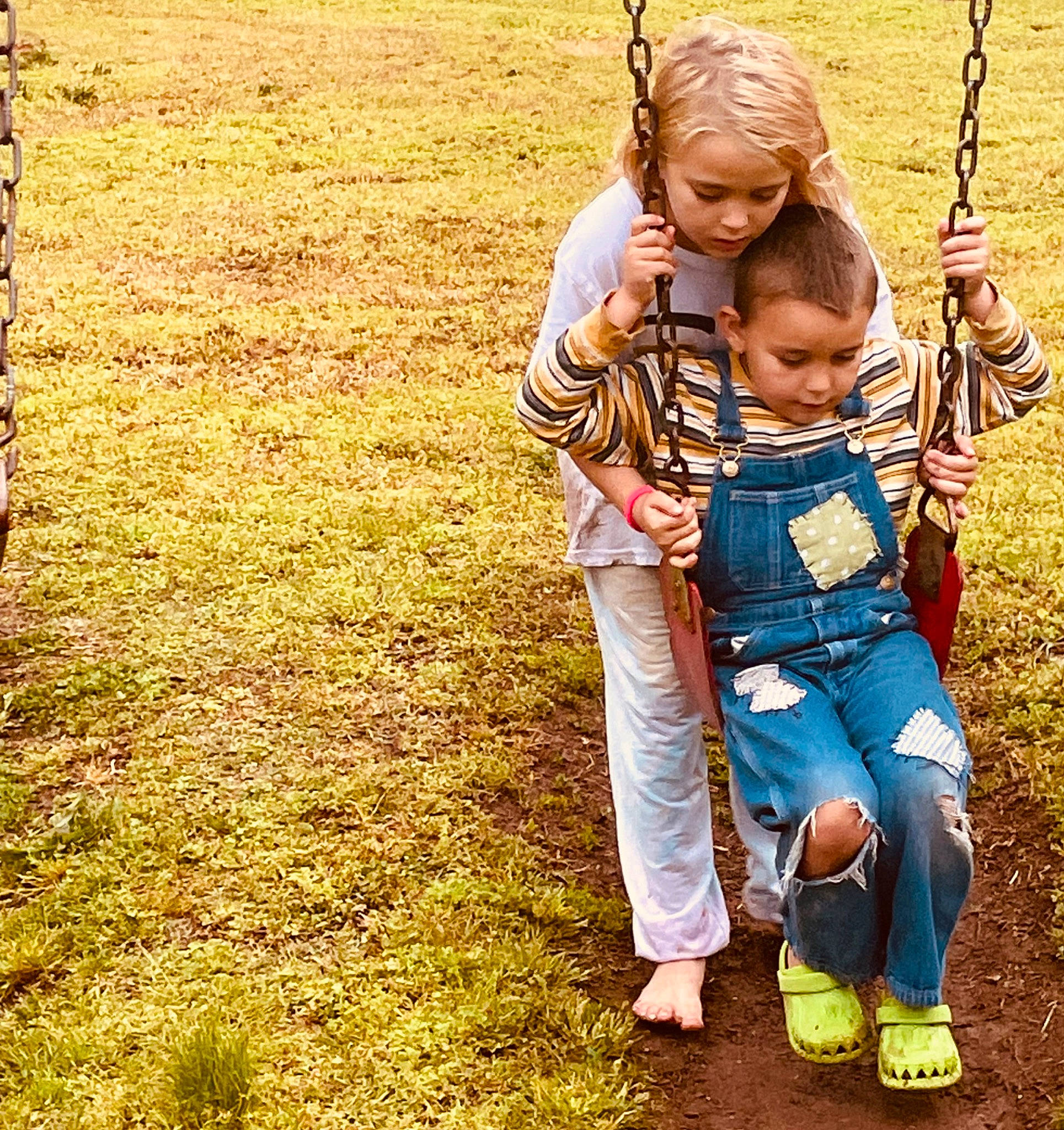 Autika joined the competition — help win amazing prizes! baby, child, city, fun, grass, grassland, happy, leisure, outdoor_play_equipment, people_in_nature, person, plant, play, playground, recreation, sandal, sitting, soil, swing, toddler