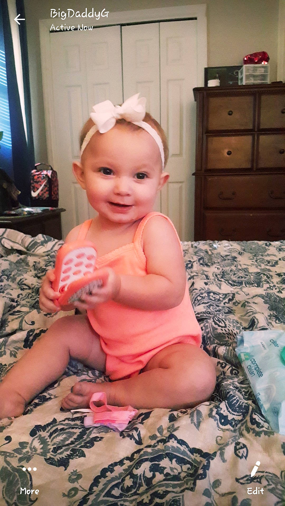 Skylee is registered to the contest to win money with this photo: baby, baby_toddler_clothing, cheek, child, ear, finger, hair_accessory, head, headband, headgear, joy, person, pink, play, sitting, thumb, toddler