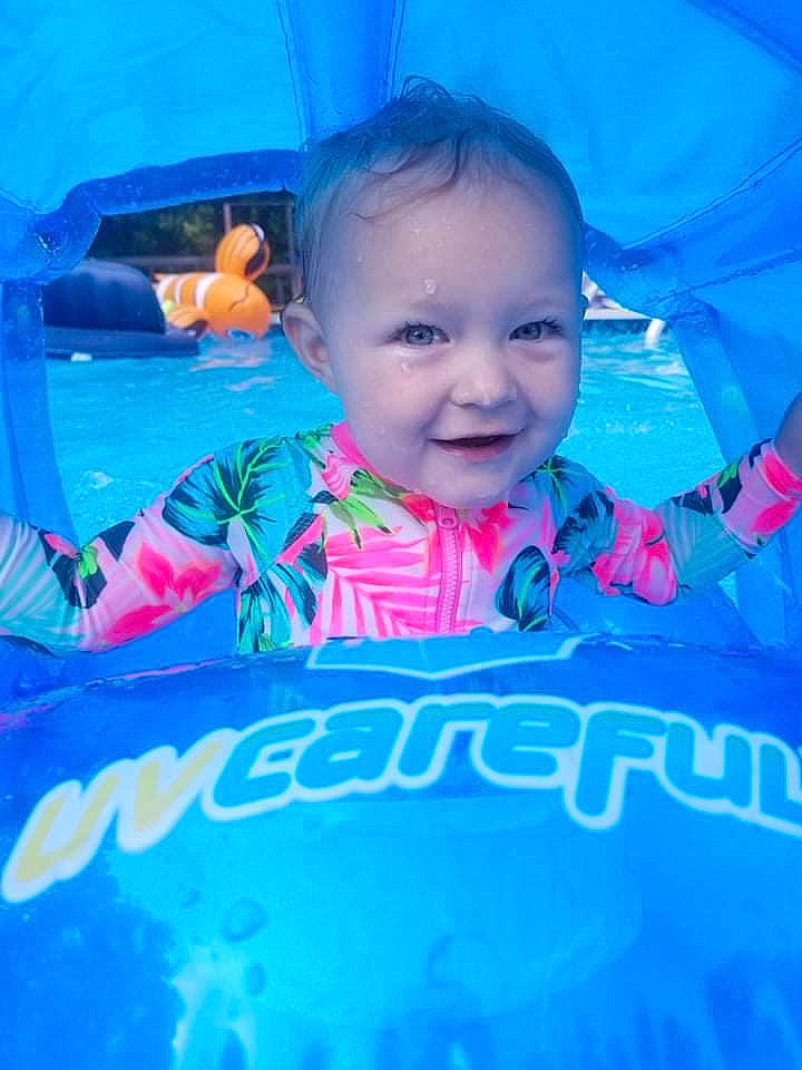 Rosealyn is registered to the contest to win money with this photo: aqua, azure, baby, baby_toddler_clothing, blue, cloud, fun, happy, human, human_body, joy, leisure, mammal, mouth, person, pink, product, skin, smile, textile