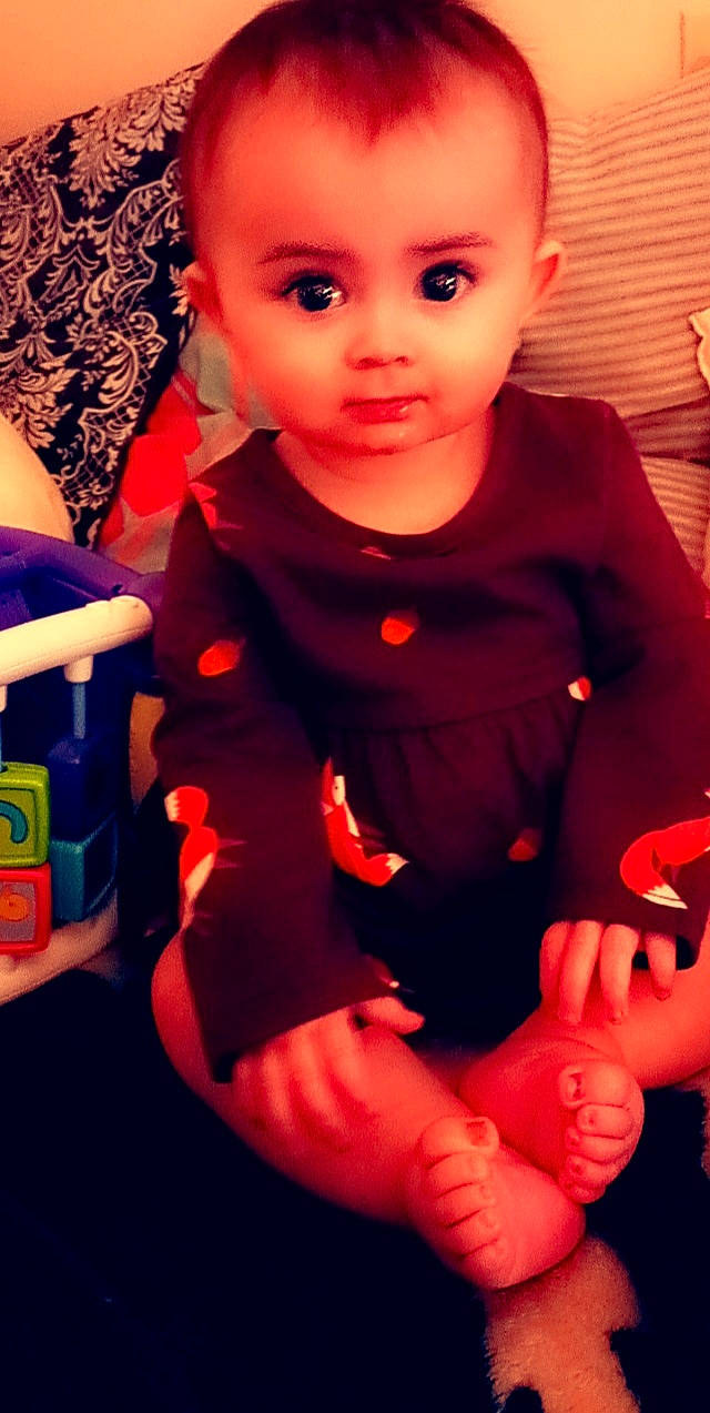 Chevelle joined the competition — help win amazing prizes! baby_toddler_clothing, cheek, facial_expression, finger, fun, gesture, happy, human, human_body, iris, lip, nose, orange, organ, person, pink, red, skin, sleeve, standing