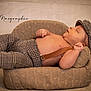 Aymen Et Késsim participe au concours pour gagner de l'argent avec cette photo : animal, baby, bonnet, canine, cap, clothing, couch, cushion, face, furniture, hat, head, homedecor, newborn, pants, person, pet, photography, portrait, sleeping