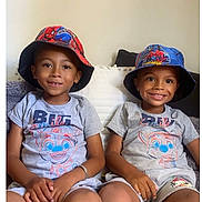 Aymen Et Késsim participe au concours pour gagner de l'argent avec cette photo : boy, brothers, bucket_hat, casual_clothing, child, couch, cute, face, happy, home, indoor, paw_patrol, pillow, portrait, shorts, sitting, smiling, spiderman, tshirt, two_people