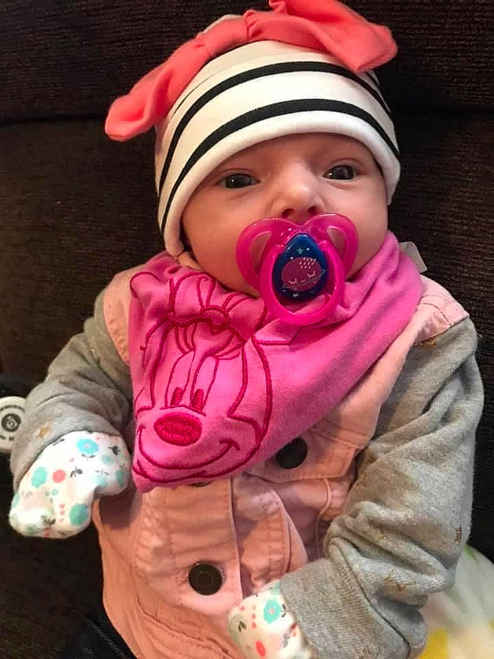 Janiyah joined the competition — help win amazing prizes! baby, baby_toddler_clothing, beanie, bonnet, cheek, child, cool, headwear, hood, knit_cap, person, pink, toddler, tongue, winter