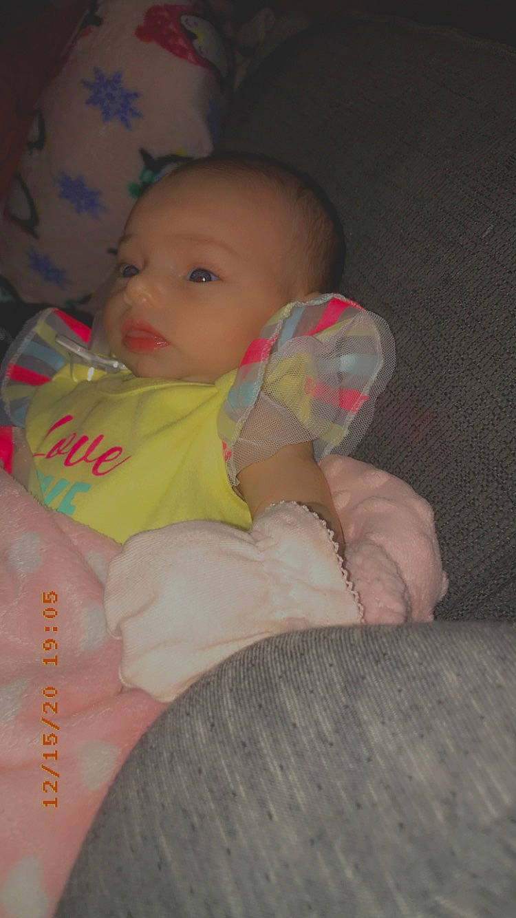 Janiyah joined the competition — help win amazing prizes! baby, baby_products, baby_toddler_clothing, bib, cheek, child, comfort, finger, hand, nail, person, skin, thumb, toddler