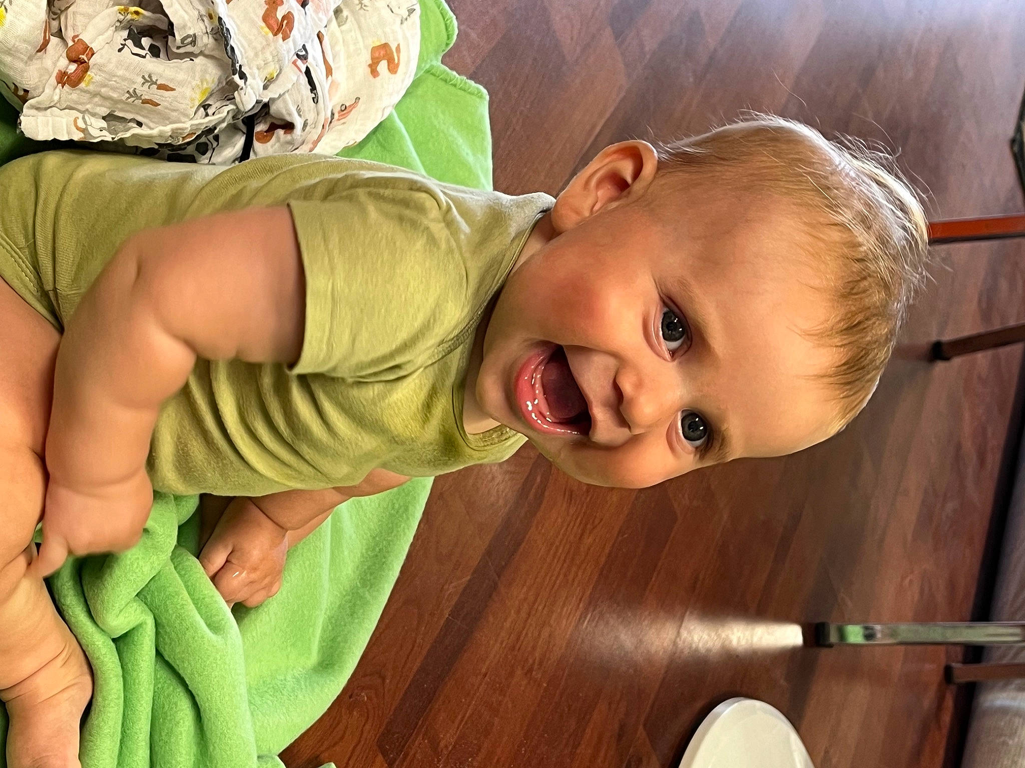 Colton is registered to the contest to win money with this photo: arm, baby, baby_products, baby_toddler_clothing, cheek, child, facial_expression, finger, fun, grass, happy, human_body, mouth, nose, person, plant, product, skin, smile, toddler