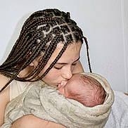 Timéo participe au concours pour gagner de l'argent avec cette photo : child, baby, braids, kissing, blanket, newborn, hugging, indoor, tender, affection, love, portrait, person, skin, closeup, caring, family, sibling, gentle, resting