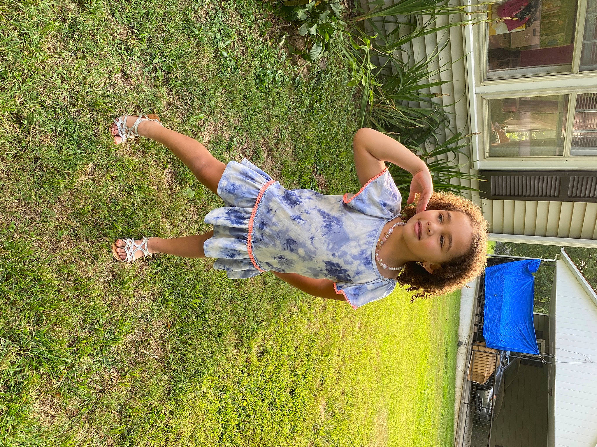 Zaryiah is registered to the contest to win money with this photo: barefoot, child, electric_blue, fun, grass, grassland, happy, joy, lawn, leisure, people_in_nature, person, plant, play, recreation, smile, t_shirt, tree, vacation, window