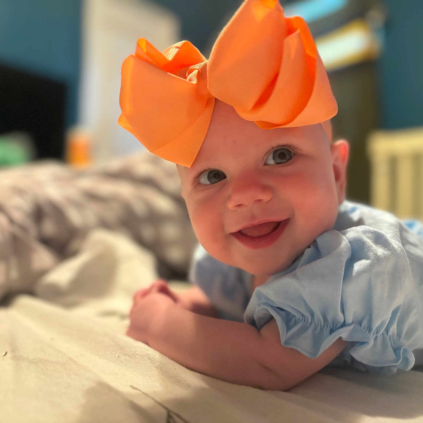 Wynona joined the competition — help win amazing prizes! baby, babylaughing, bed, bodypart, cap, cartoon, clothing, costume, face, finger, furniture, hand, happy, hat, head, newborn, person, photography, portrait, smile