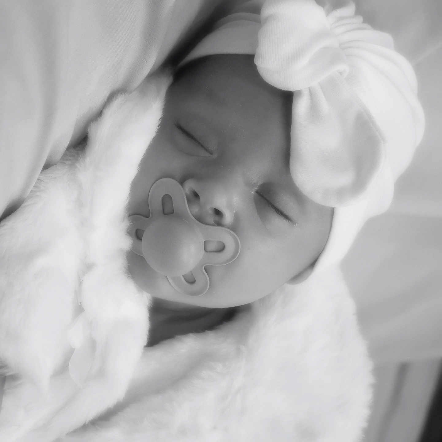 Reyli joined the competition — help win amazing prizes! baby, blanket, bow, child, closeup, cozy, cute, face, hat, headwear, infant, monochrome, newborn, pacifier, peaceful, portrait, resting, sleeping, soft, wrapped