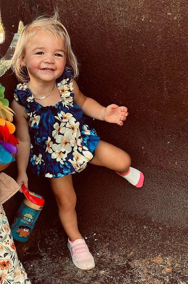 Aria Lynn joined the competition — help win amazing prizes! baby_toddler_clothing, blond, child, day_dress, dress, electric_blue, event, fun, grass, happy, human_leg, joy, pattern, people_in_nature, person, play, sandal, sitting, smile, soil