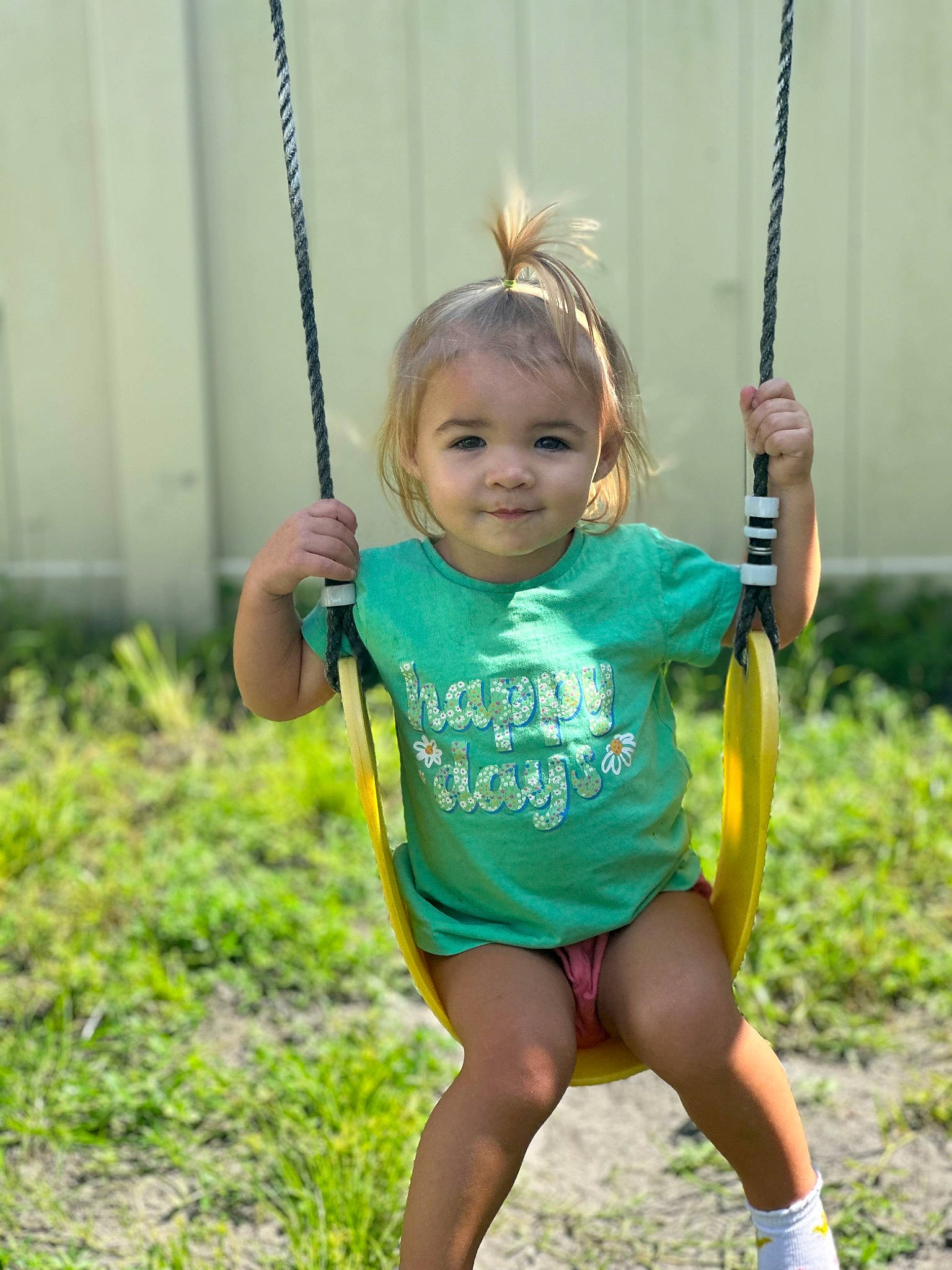Aria Lynn is registered to the contest to win money with this photo: city, clothing, face, fun, grass, hand, happy, joy, leisure, outdoor_play_equipment, people_in_nature, person, plant, play, playground, recreation, smile, summer, swing, thigh