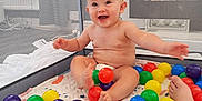 Ruben joined the competition — help win amazing prizes! baby, child, playpen, ball_pit, colorful_balls, smiling, happy, indoor, toy, diaper, mesh_sides, play_area, feet, skin, infant, playtime, crawling, cute, fun, joy