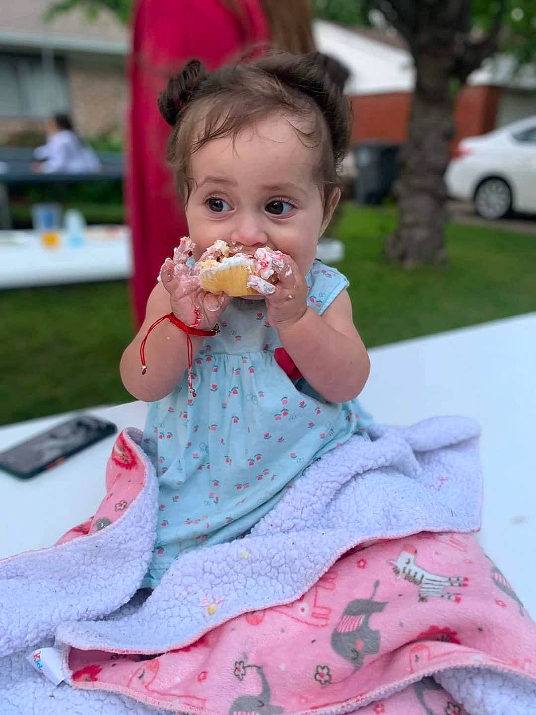 Leilani is registered to the contest to win money with this photo: baby, baby_toddler_clothing, cheek, child, dress, event, face, food_craving, grass, happy, head, leisure, person, pink, recreation, skin, summer, sweetness, tire, toddler