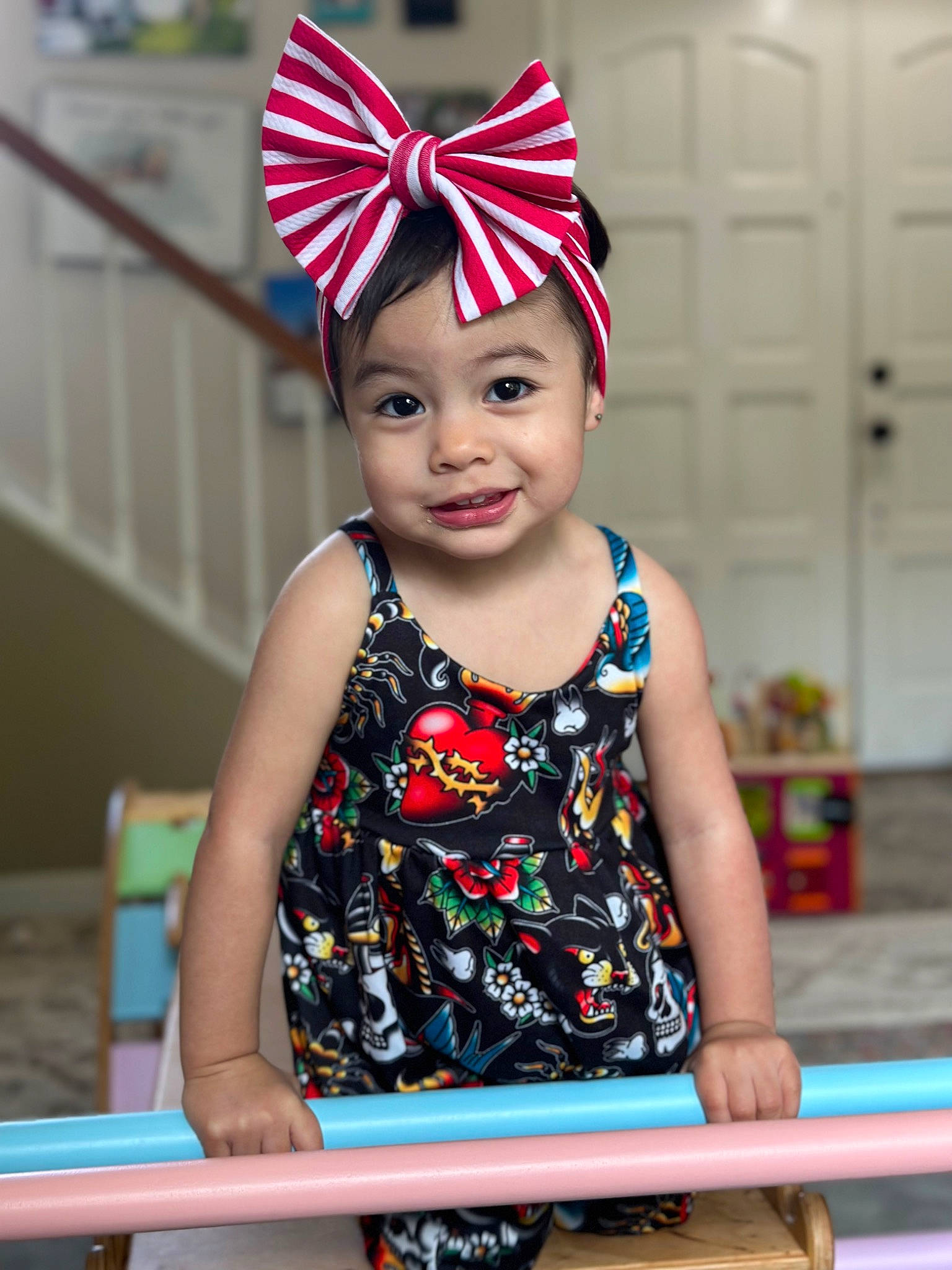 Liliana is registered to the contest to win money with this photo: baby_toddler_clothing, cap, costume_hat, event, fashion_accessory, fun, happy, headgear, headwear, joy, leisure, magenta, party_hat, party_supply, person, pink, recreation, red, sleeve, smile